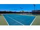 Well-maintained tennis courts with bright blue surface, ready for a competitive match at 5104 Elm Grove Dr, Las Vegas, NV 89130