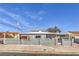 Charming single story home with a concrete fence and well-maintained front yard at 513 Elm St, Boulder City, NV 89005