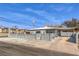 Cozy home with a concrete fence and an attached covered parking area at 513 Elm St, Boulder City, NV 89005