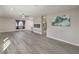 Bright, open-concept living room featuring stylish laminate flooring and recessed lighting at 513 Elm St, Boulder City, NV 89005