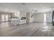Open-concept living space with modern fireplace, gray floors, and natural light at 513 Elm St, Boulder City, NV 89005