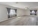 Spacious living room with large windows and elegant gray laminate flooring at 513 Elm St, Boulder City, NV 89005
