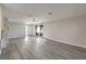 Inviting living room featuring a large window, laminate flooring, and ample natural light at 513 Elm St, Boulder City, NV 89005