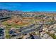 Aerial view of a baseball park integrated into a residential area, complemented by green spaces and community roads at 5741 Shadow Bend Dr, Las Vegas, NV 89135