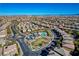 High-angle view of a Gathering-friendly neighborhood, highlighting a community park with a pool and playground at 5741 Shadow Bend Dr, Las Vegas, NV 89135