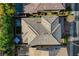 Overhead shot showcasing roof, backyard features including hot tub, pergola, and lush landscaping with shade trees at 5741 Shadow Bend Dr, Las Vegas, NV 89135