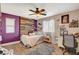 Unique bedroom featuring wood accent wall and a large window for natural light at 5741 Shadow Bend Dr, Las Vegas, NV 89135