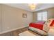 Bright bedroom with wood-look floors, a comfortable bed, and natural light from the window at 5741 Shadow Bend Dr, Las Vegas, NV 89135