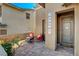 Welcoming front porch area featuring a cozy seating area and stylish decor at 5741 Shadow Bend Dr, Las Vegas, NV 89135