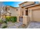 Inviting front entrance with manicured landscaping, brick walkway, and charming gate at 5741 Shadow Bend Dr, Las Vegas, NV 89135