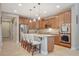 Modern kitchen featuring an island with seating, stainless steel appliances, and ample cabinetry at 5741 Shadow Bend Dr, Las Vegas, NV 89135