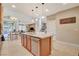Open kitchen with stainless steel appliances, center island, and eat in dining area at 5741 Shadow Bend Dr, Las Vegas, NV 89135