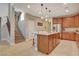 Open kitchen featuring stainless appliances, center island, and granite countertops at 5741 Shadow Bend Dr, Las Vegas, NV 89135