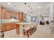 Spacious kitchen with stainless steel appliances, breakfast bar, and granite countertops at 5741 Shadow Bend Dr, Las Vegas, NV 89135