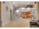 Expansive open-concept living area with a staircase, providing seamless flow to the kitchen and dining space at 5741 Shadow Bend Dr, Las Vegas, NV 89135