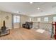 Spacious living room with wood floors, a comfy couch, and ample natural light for relaxation at 5741 Shadow Bend Dr, Las Vegas, NV 89135