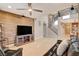 Spacious living room with a feature wall, staircase to the second floor, and open access to the kitchen at 5741 Shadow Bend Dr, Las Vegas, NV 89135