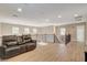 Upstairs loft with wood floors, a comfortable couch, and railing overlooking the lower level at 5741 Shadow Bend Dr, Las Vegas, NV 89135