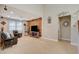 Living room featuring a modern accent wall, tile flooring, and media center at 5741 Shadow Bend Dr, Las Vegas, NV 89135