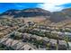 Picturesque neighborhood view against a mountain backdrop, showcasing uniform housing design and community planning at 5741 Shadow Bend Dr, Las Vegas, NV 89135