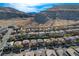 Elevated view of a neighborhood nestled against a dramatic mountain range with clear blue skies at 5741 Shadow Bend Dr, Las Vegas, NV 89135