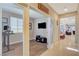 Spacious office with natural light, wood-look floors, and open doorway to living area at 5741 Shadow Bend Dr, Las Vegas, NV 89135