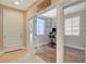 Bright office space with modern glass doors, wood-look floors, and neutral tones at 5741 Shadow Bend Dr, Las Vegas, NV 89135