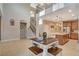 Open concept living area showcasing the kitchen, dining, and staircase at 5741 Shadow Bend Dr, Las Vegas, NV 89135