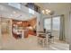 Open concept kitchen and dining space under the balcony at 5741 Shadow Bend Dr, Las Vegas, NV 89135