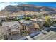 Street view of well-maintained homes featuring desert landscaping in front and mountain views in the background at 5741 Shadow Bend Dr, Las Vegas, NV 89135