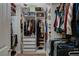 Walk-in closet boasting custom shelving, drawers, and ample hanging space for organized storage at 5741 Shadow Bend Dr, Las Vegas, NV 89135