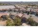 Aerial view of neighborhood featuring single-Gathering homes and lush trees at 575 Lacabana Beach Dr, Las Vegas, NV 89138