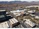 Aerial view of open-air shopping complex featuring white tent and lush trees at 575 Lacabana Beach Dr, Las Vegas, NV 89138