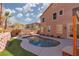 Beautiful backyard pool surrounded by green space and a private patio area at 575 Lacabana Beach Dr, Las Vegas, NV 89138