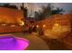 Inviting backyard featuring a pool, sun loungers, and egg chair, perfect for outdoor relaxation at 575 Lacabana Beach Dr, Las Vegas, NV 89138