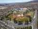 Aerial shot of baseball fields with green and brown dirt, part of a community park with surrounding homes at 575 Lacabana Beach Dr, Las Vegas, NV 89138