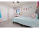 This bedroom features a plush blue bed, soft pillows, and a charming vanity area at 575 Lacabana Beach Dr, Las Vegas, NV 89138