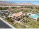 Aerial view of a community center with a pool and landscaped grounds, offering a relaxing environment at 575 Lacabana Beach Dr, Las Vegas, NV 89138
