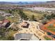 Aerial perspective of a vibrant community park with baseball field, picnic areas, and green spaces at 575 Lacabana Beach Dr, Las Vegas, NV 89138