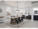 Well-lit dining room showcasing a large wooden table and access to a powder room at 575 Lacabana Beach Dr, Las Vegas, NV 89138