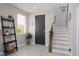 Inviting entryway with stylish decor, staircase, and modern finishes, creating a warm welcome at 575 Lacabana Beach Dr, Las Vegas, NV 89138