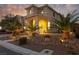 Charming two-story home with landscaped yard and covered porch, perfect for enjoying evenings at 575 Lacabana Beach Dr, Las Vegas, NV 89138