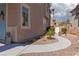 Well-maintained front yard with a decorative walkway leading to the front door at 575 Lacabana Beach Dr, Las Vegas, NV 89138