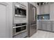 Gourmet kitchen with stainless steel appliances, custom cabinets and built in coffee maker at 575 Lacabana Beach Dr, Las Vegas, NV 89138
