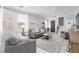 Bright living room features modern furnishings, large windows, and a cozy atmosphere at 575 Lacabana Beach Dr, Las Vegas, NV 89138