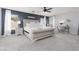 Spacious main bedroom with a tufted headboard and a cozy sitting area at 575 Lacabana Beach Dr, Las Vegas, NV 89138