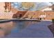 Sparkling pool area with lounge chairs, stylish decor, and a peaceful outdoor setting at 575 Lacabana Beach Dr, Las Vegas, NV 89138