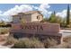 A sign indicating the Sonesta neighborhood, with stone base and desert landscaping at 575 Lacabana Beach Dr, Las Vegas, NV 89138