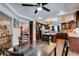 Open-concept dining area leading to a modern kitchen with stainless steel appliances at 6686 Enchanted Cove Ct, Las Vegas, NV 89139