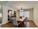 Dining room with wood floors, natural light, and views of the living room at 6686 Enchanted Cove Ct, Las Vegas, NV 89139